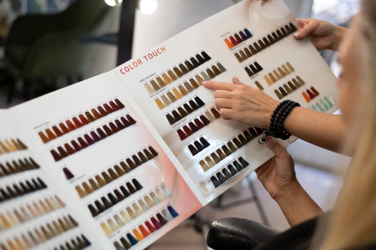woman choosing new hair color from catalog Best Hair Color in India: Choose the Perfect Shade for Your Hair Style